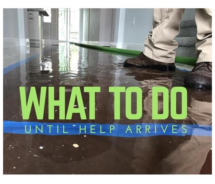 This photo shows an example of a water damage inside a home as water pools on the wooden floors.