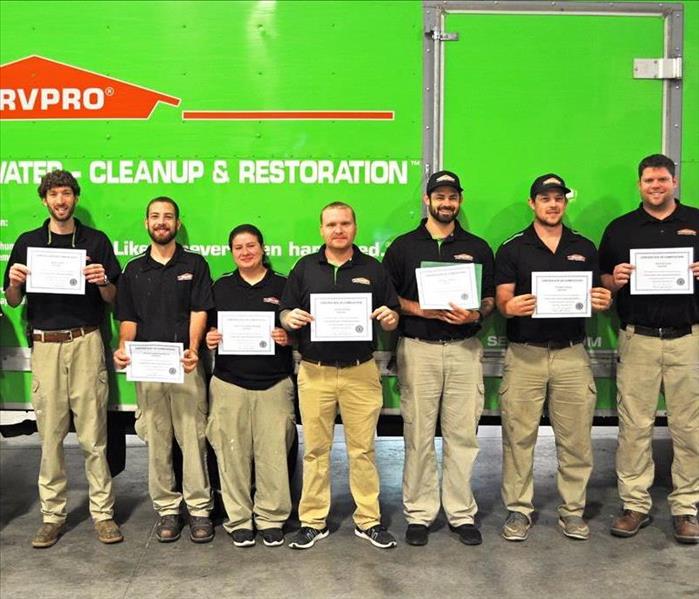 SERVPRO employees holding certificates